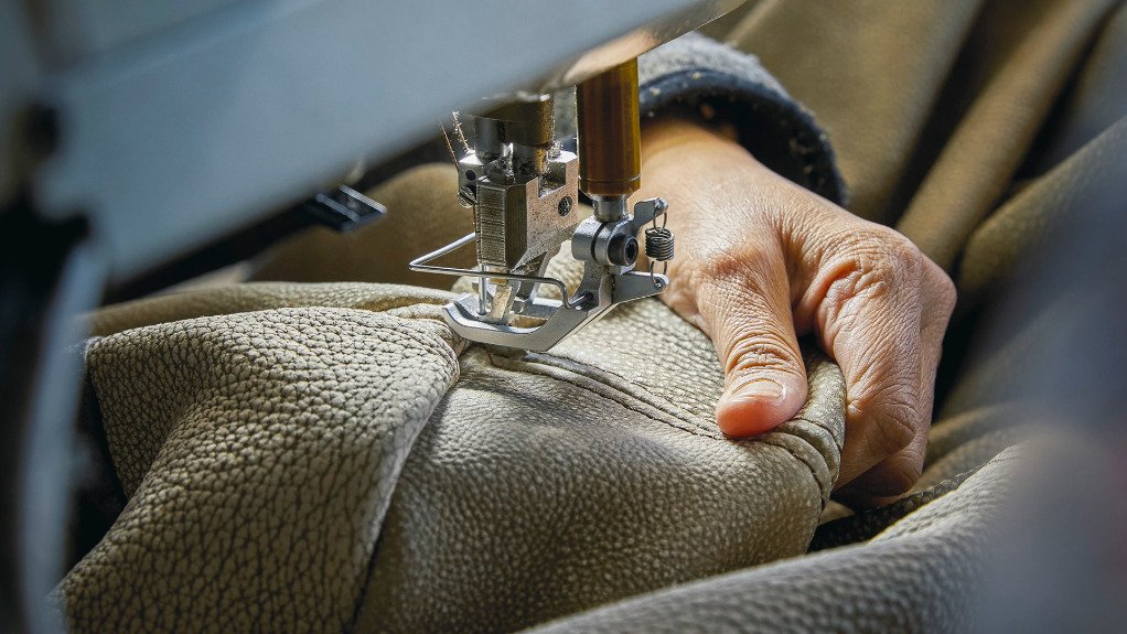 Worker sewing upholstery