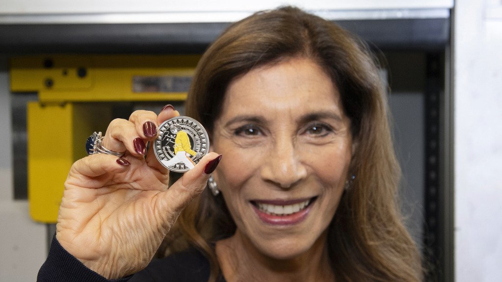 Kashmira Bulsara with a coin celebrating the life of her brother Freddie Mercury