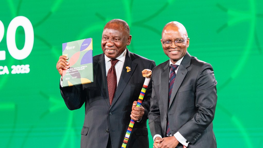 President Cyril Ramaphosa receiving the B20 communiqué and talking stick from B20 chair Mxolisi Mgojo at the conclusion of the B20 Summit