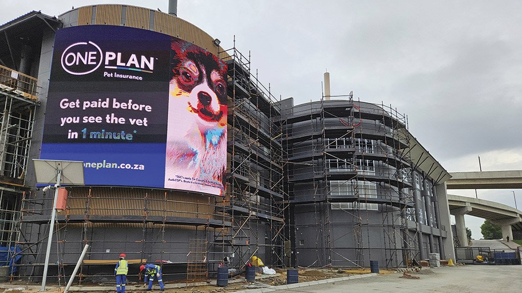 Timber cladding installation underway as part of the façade refurbishment at Concor’s The View project at Fourways Mall