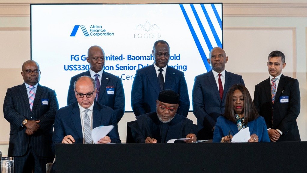 Executives from FS Gold, Afreximbank and the AFC sign a loan agreement