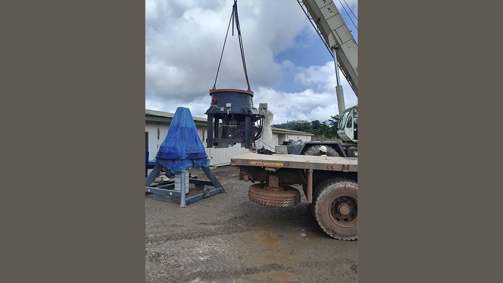Components for the new Sandvik CH851i cone crusher supplied by Sandvik Rock Processing being offloaded on site at a gold mine in Ghana