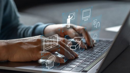 An image of somebody using a laptop