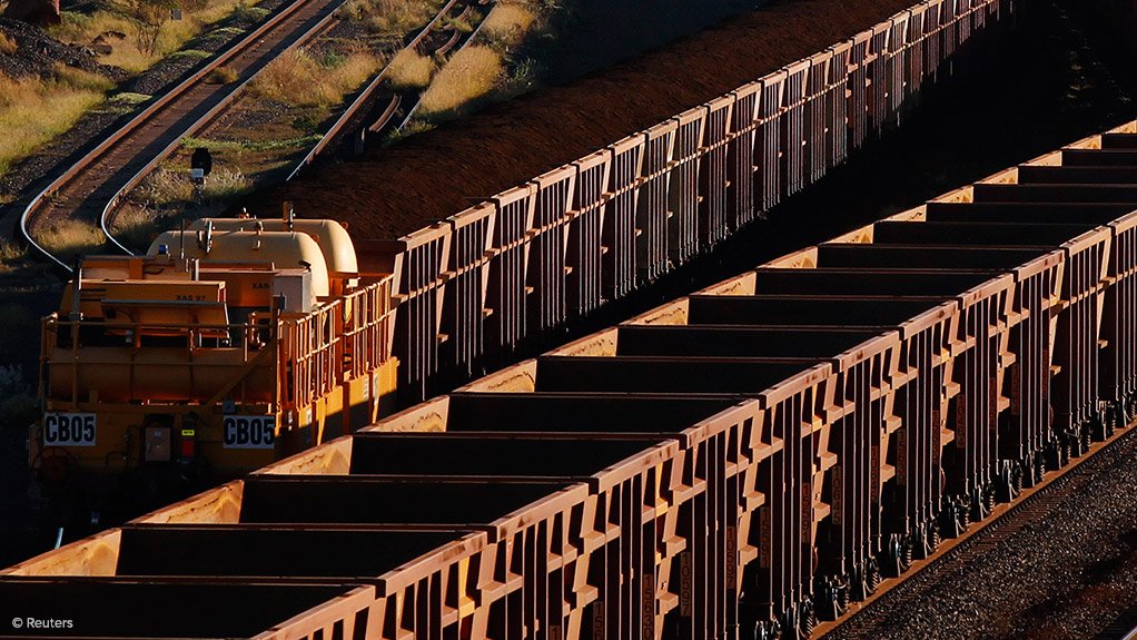 Iron-ore being transported by rail