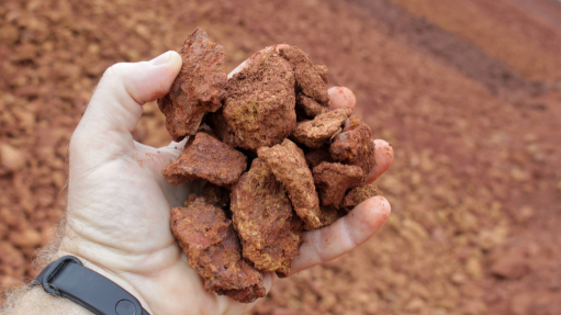 Image of bauxite ore in hand