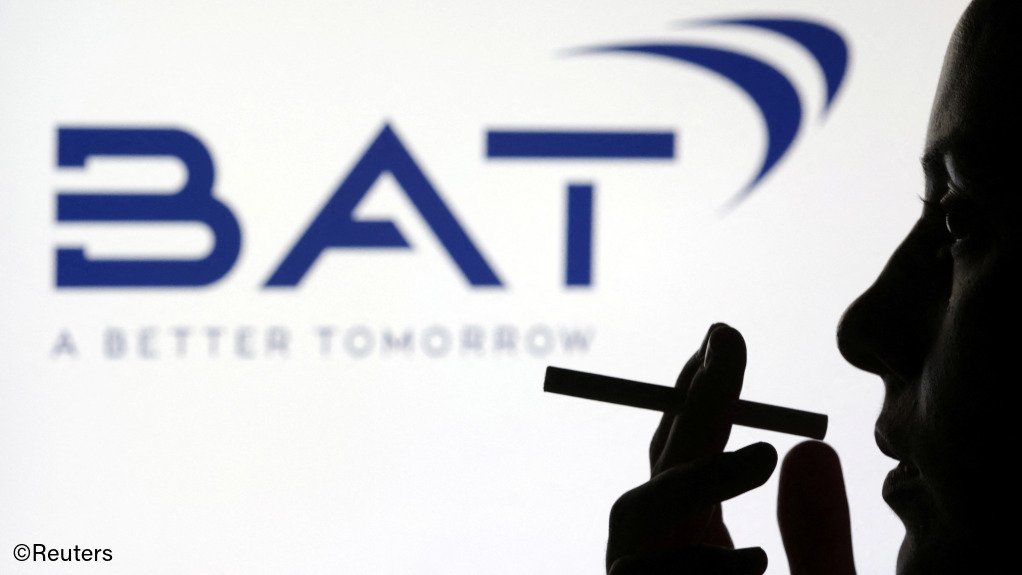 Silhouette of a woman holding a cigarette