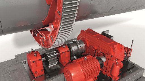 This image captures a segmented girth gear working in tandem with an industrial gear unit in action to drive high-performance, large-diameter rotating equipment.