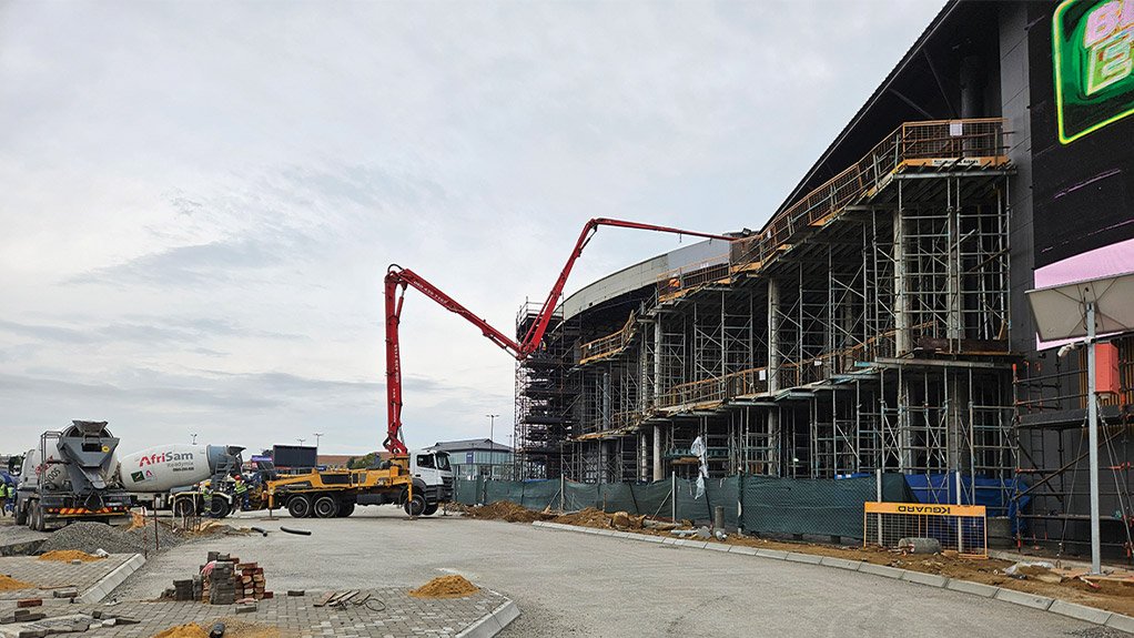 Concrete casting in progress on the balcony extensions at Concor’s The View project at Fourways Mall.