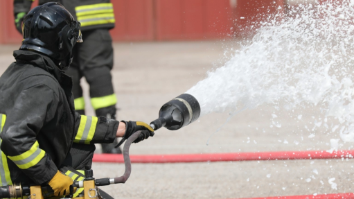 An image of workers extinguishing a fire