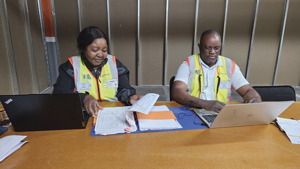 Concor HSE Manager Margaret Dube and Safety Officer Givemore Mupondi conducting a safety file audit, demonstrating the company’s commitment to rigorous compliance and continuous improvement