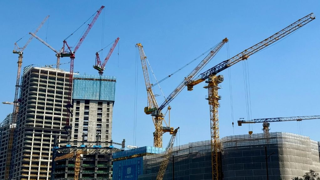 A construction site with cranes 