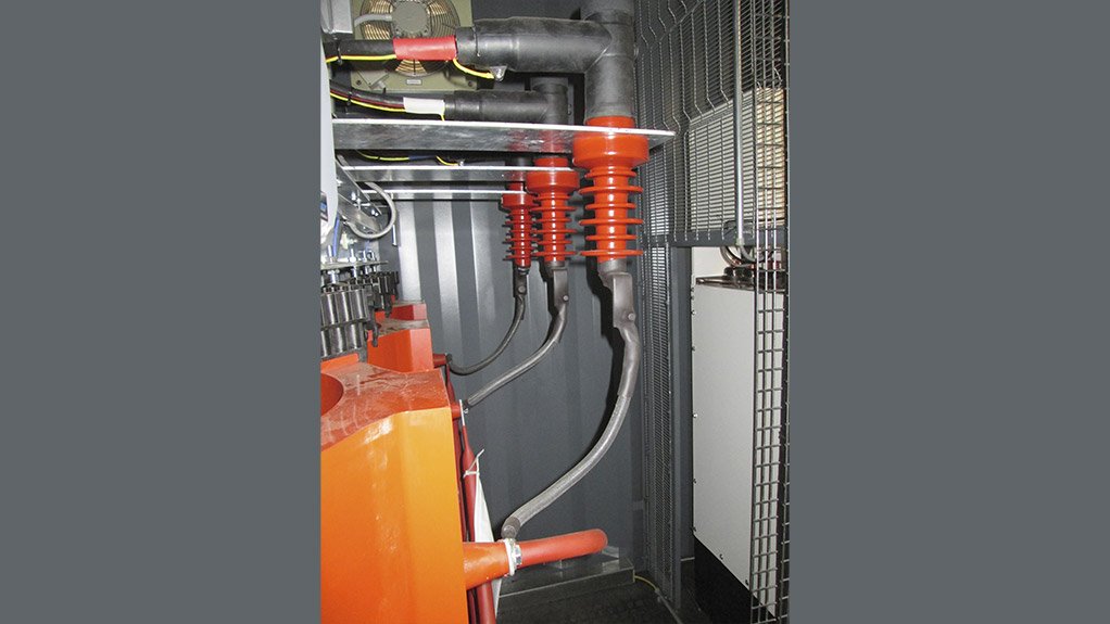 A close-up view of the high-voltage connection on the dry-type transformer, highlighting the secure cable terminations and insulation system used to ensure operational safety