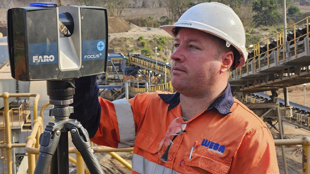 Dewald Tintinger, Technical Director at Weba Chute Systems, conducting on-site surveys in Sierra Leone using advanced 3D laser scanning technology