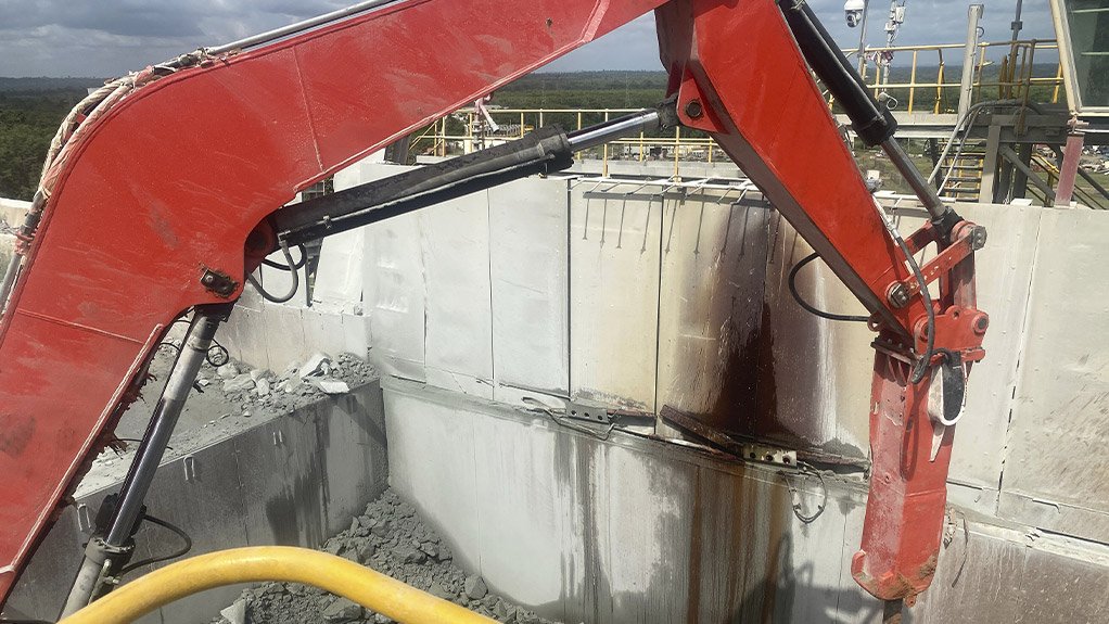 The Sandvik rock breaker is being carefully positioned to ensure safe and effective operation