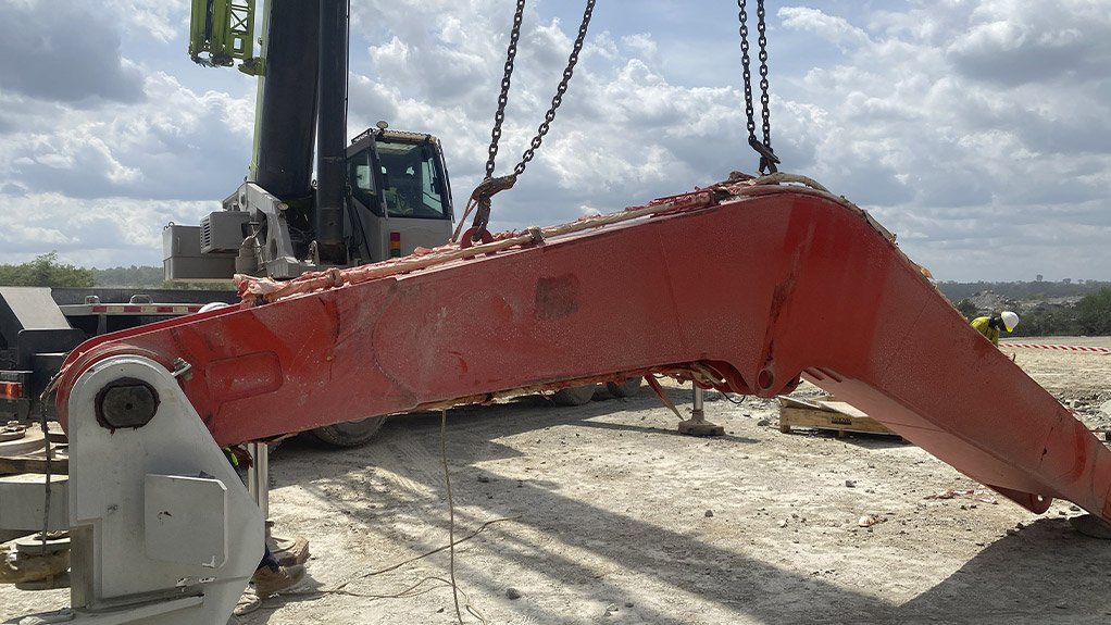 Coupling of the main boom to the pedestal is underway as part of the Sandvik rock breaker installation