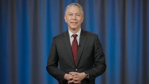 CEO Mike Henry delivering BHP's half-year results.