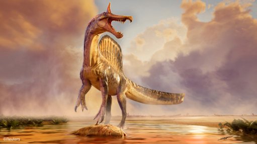 Illustration of the Spinosaurus mirabilis standing at water's edge over a carcass of the coelacanth Mawsonia some 95-million years ago in what is now the Sahara Desert in Niger.