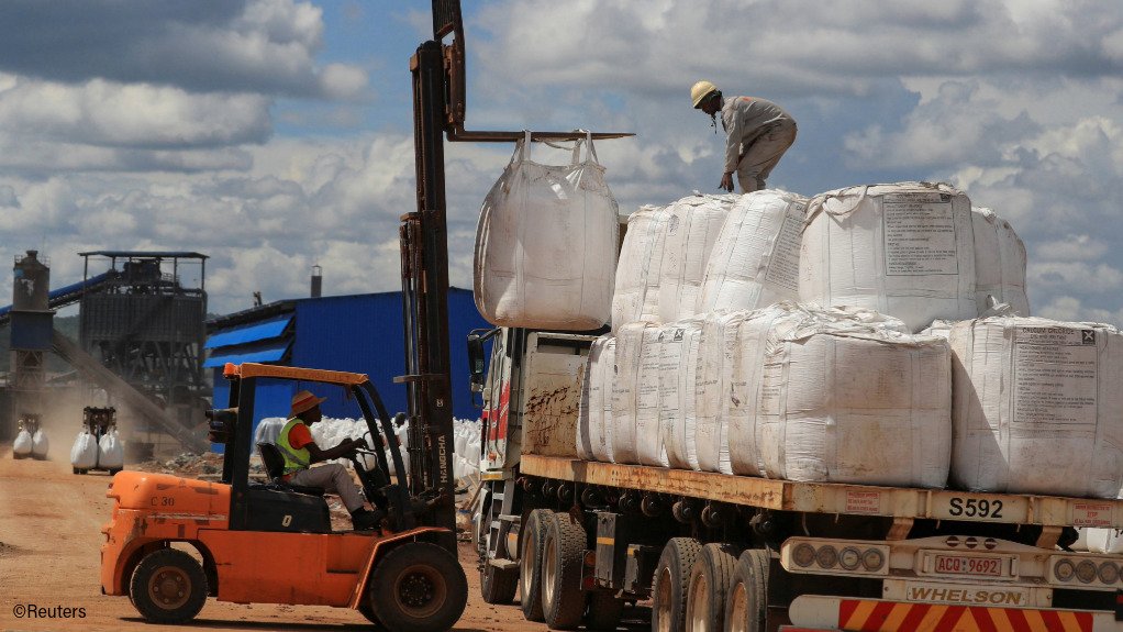 Bags of lithium concentrate being loaded onto a truck
