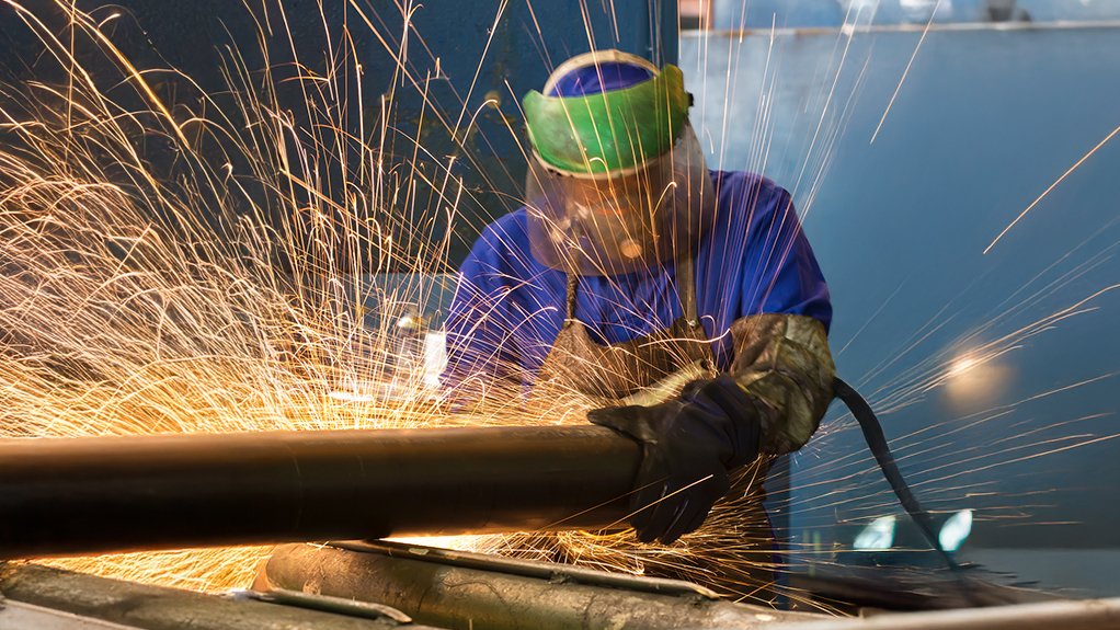 An image of soldering a steel elongated roof support