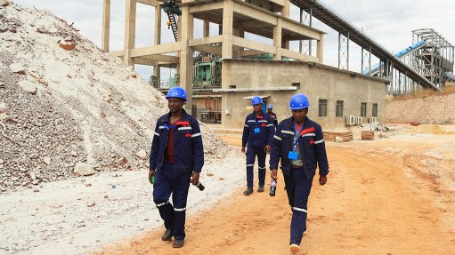 Employees walking at a lithium mine in Zimbabwe