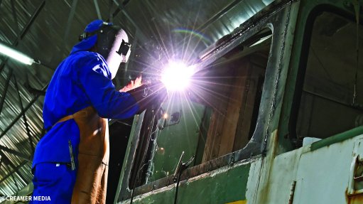 A welder working at Traxtion's rail workshop in Rosslyn
