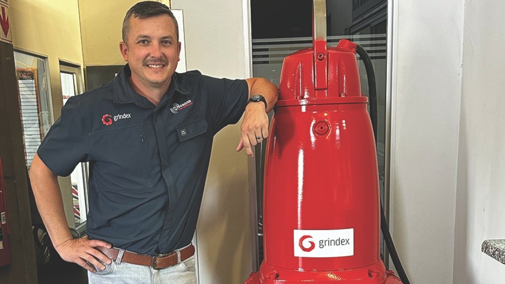 Jordan Marsh standing next to Grindex pump