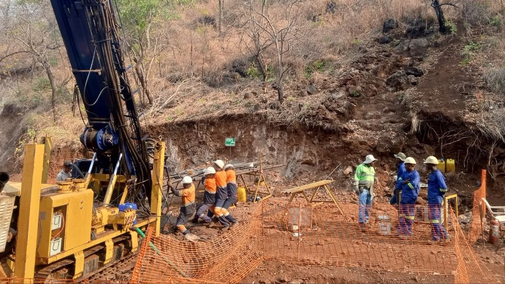 Workers on site at Monte Muambe