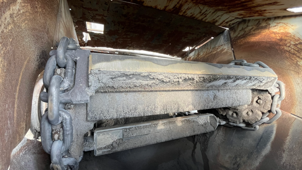 An image of chains attached to a conveyor component