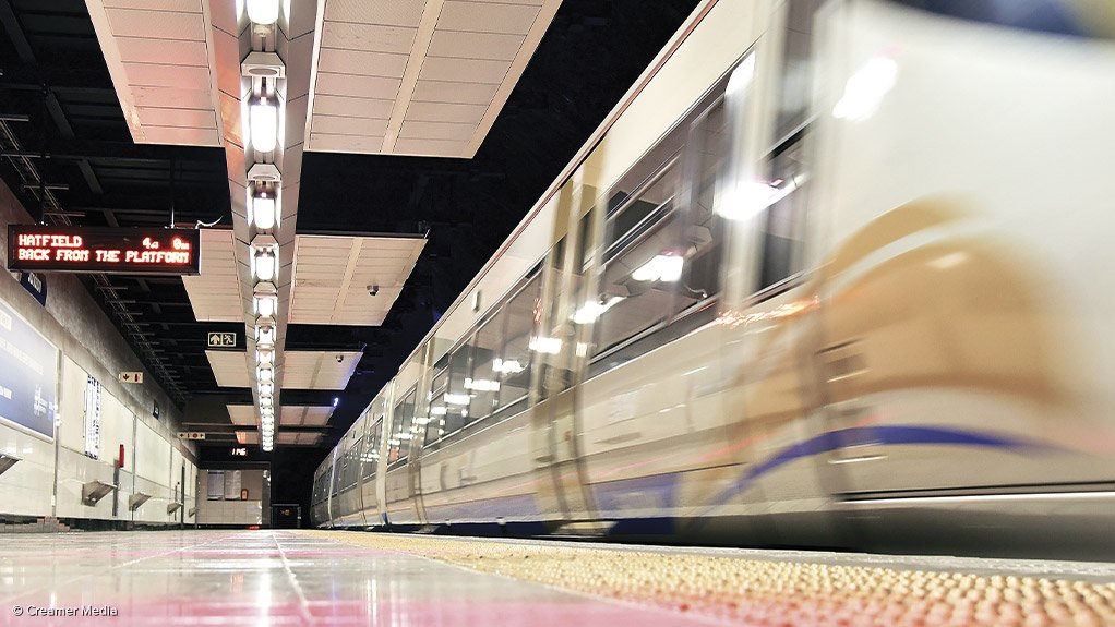 A Gautrain passing through a station