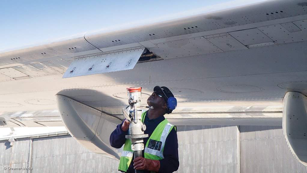 Worker preparing to refuel an aeroplane
