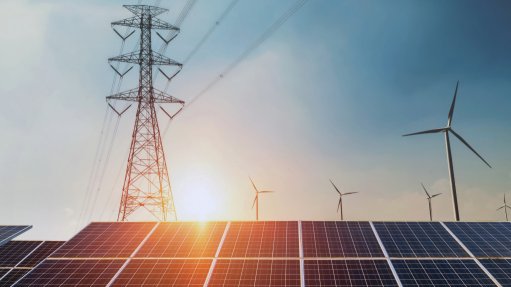 A generic image of an electricity pylon and solar panels 