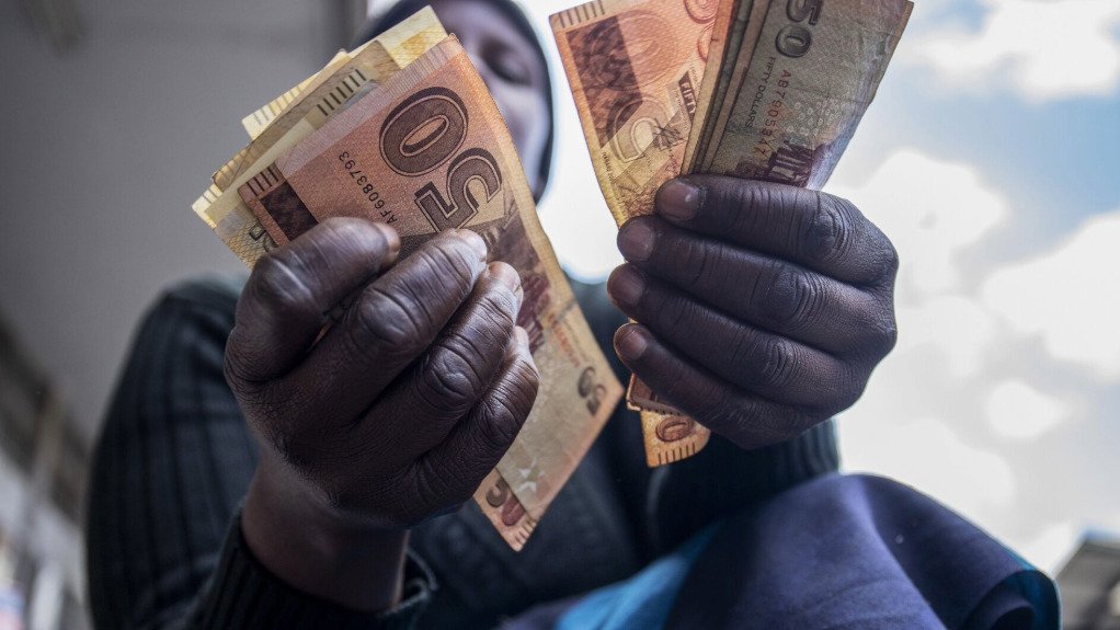 Zimbabwe dollars in hand