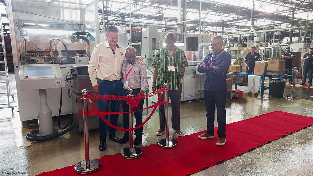 Coleus Packaging MD Ian Victor and Nokusa Packaging MD Phillip Sathekge opening the new line on March 20