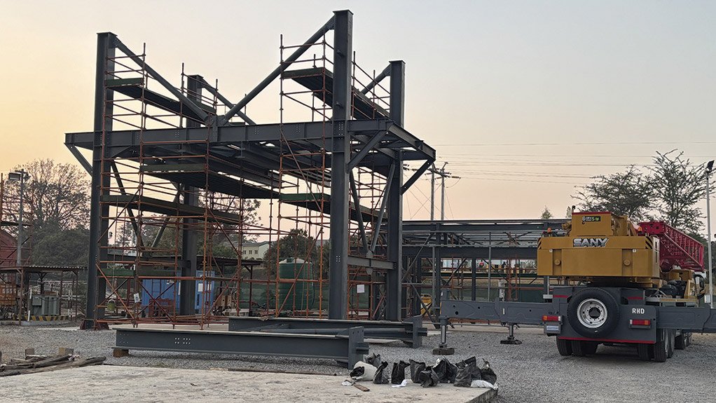 Structural steel components of the ore loading bin prepared for assembly on site