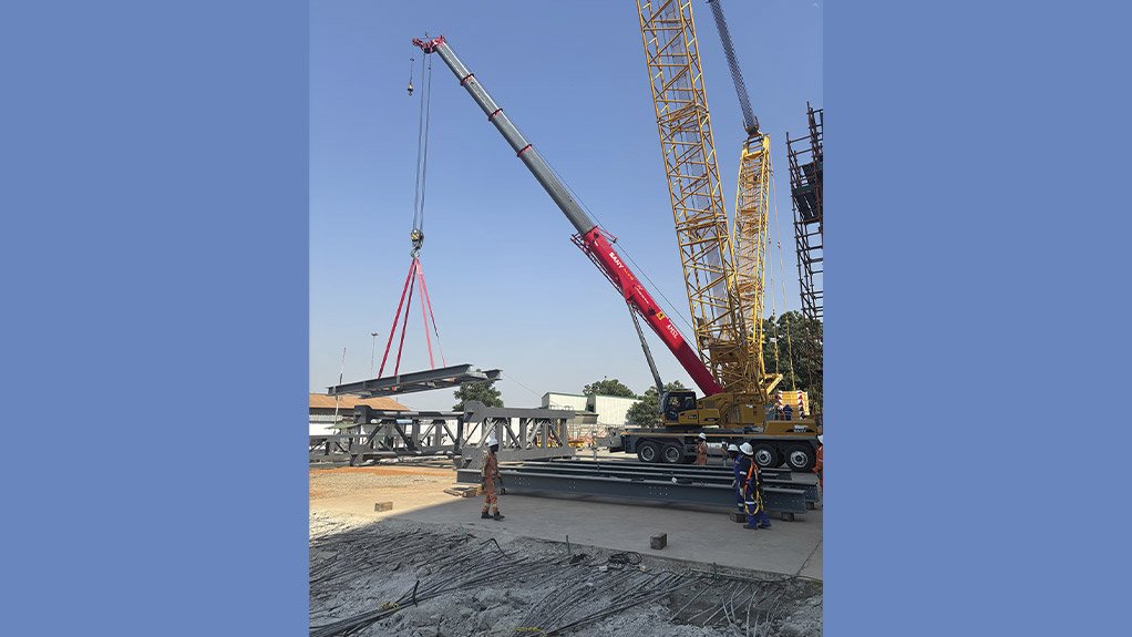 Assembly of the headgear centre columns progresses as key structural elements are positioned on site