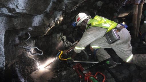 Hydro Power Equipment’s Isidingo drill and drill guide system being used by a miner in PPE