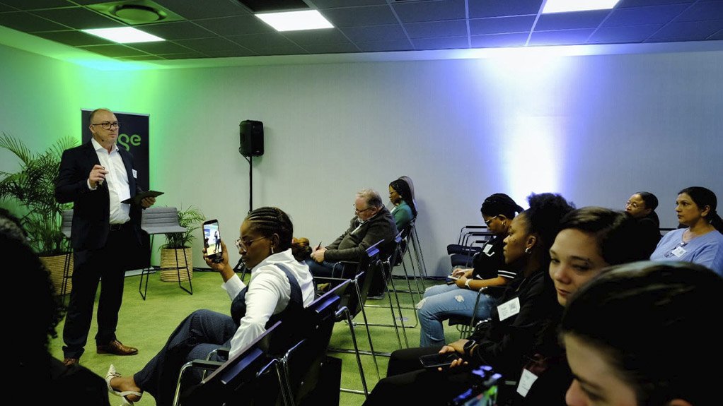 Image of a speaker presenting Sage Ai technology to an audience