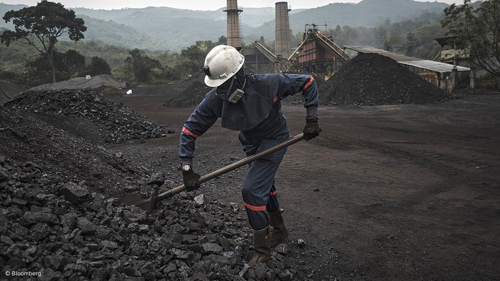 Coal mine site with worker in Colombia