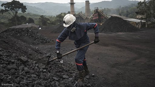 Coal mine site with worker in Colombia