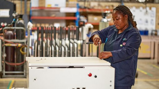 Image of a technician assembling a HVAC unit 