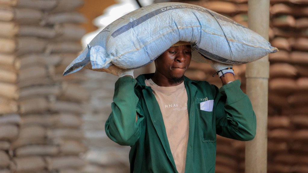A generic image of a farmer carrying a sack