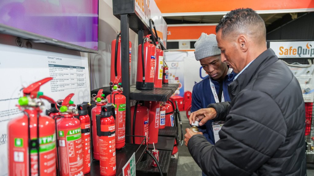 The above image depicts an exhibitor demonstrating the use of a fire extinguisher
