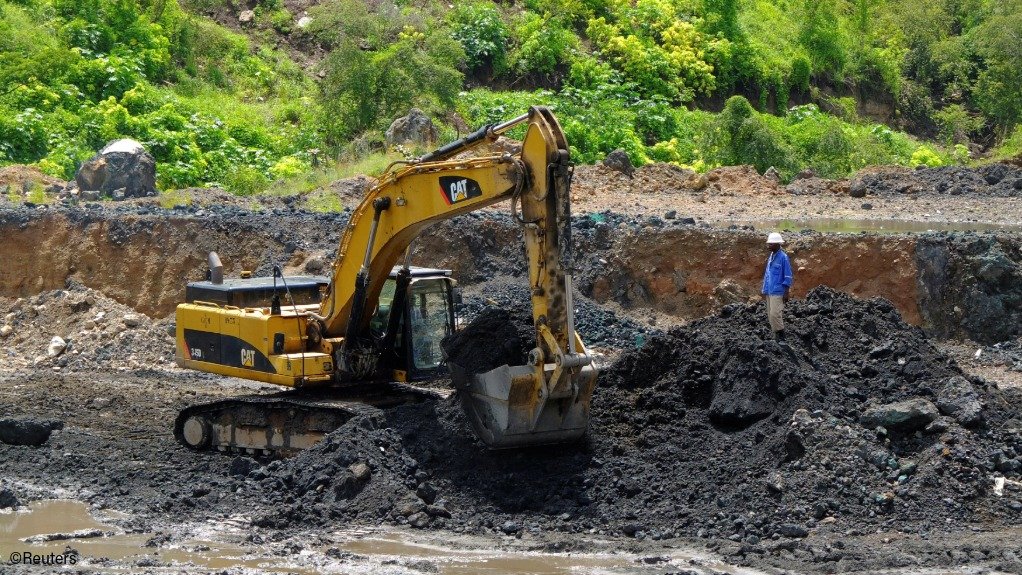 An excavator at work at a copper mine in the DRC