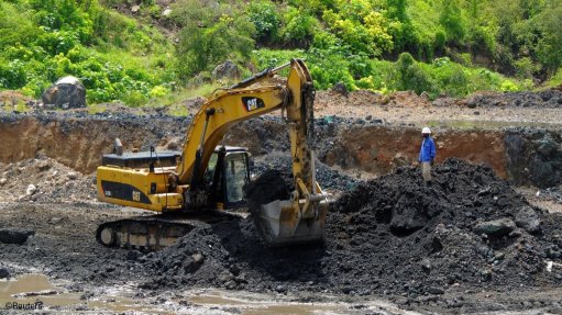 An excavator at work at a copper mine in the DRC