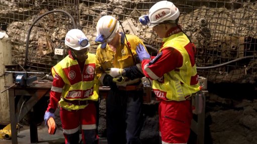 ER24 paramedics assisting an injured miner all in PPE
