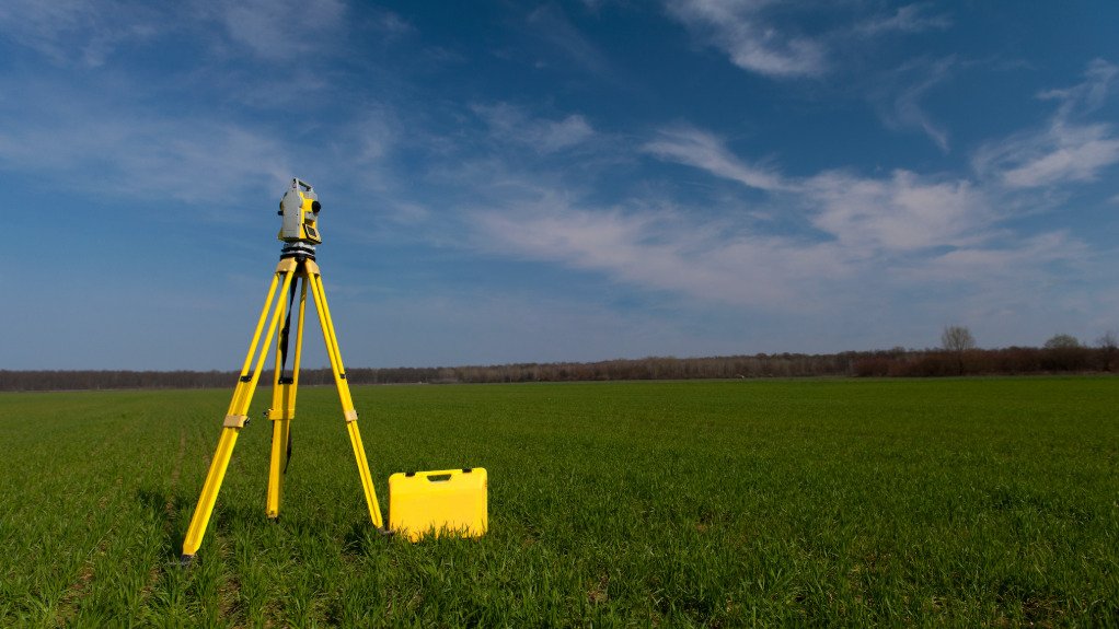 a geospatial measuring tool in a large green field