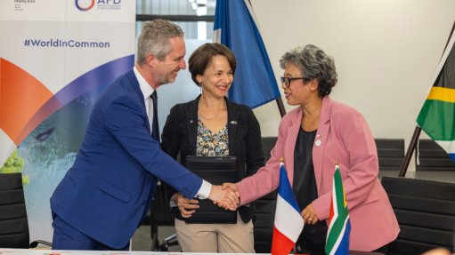 French Ambassador to South Africa, Lesotho and Malawi David Martinon (left), with AFD’s regional director for Southern Africa Marie-Hélène Loison and Transnet CEO Michelle Phillips at the signing ceremony.
