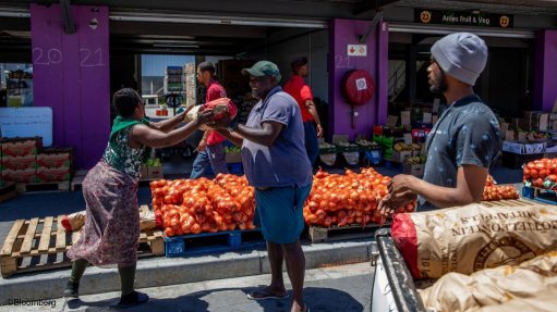 People buying vegetables at a market