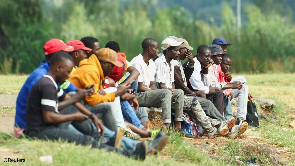 Job seekers waiting to be hired for temporary jobs