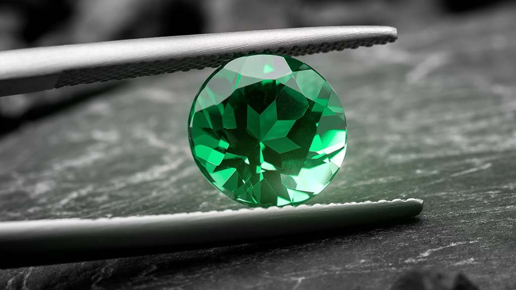 A cut and polished emerald